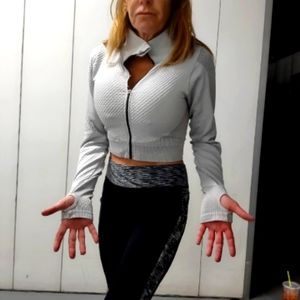 Athletic medium grey jacket with holes for thumbs. The athletic pants are large